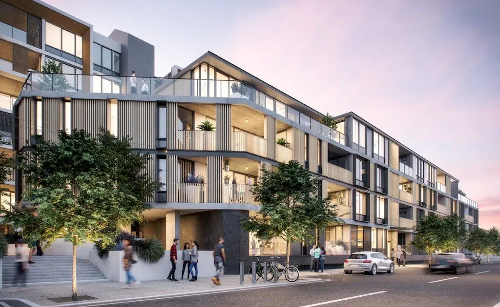 Modern apartment building exterior with balconies, street view, and people walking. Real estate architecture with natural light.